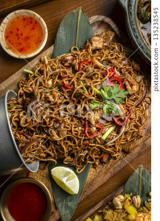 pad thai chicken stir fry noodles in modern restaurant in thailand 135238545