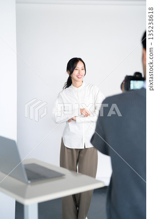 A female model and a male photographer giving instructions A female model and a male photographer giving instructions 135238618