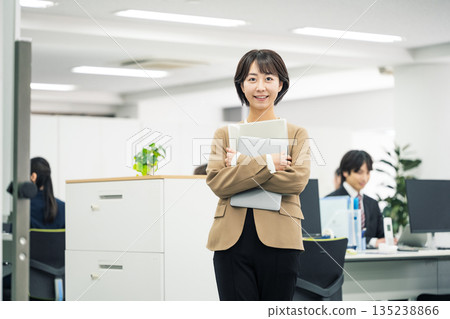 Portrait of a young career woman working in an office 135238866