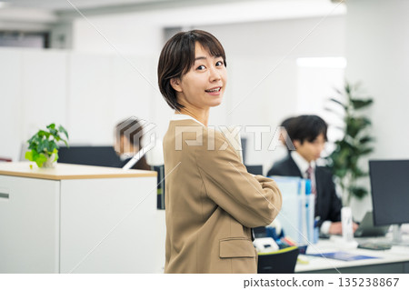Portrait of a young career woman working in an office 135238867