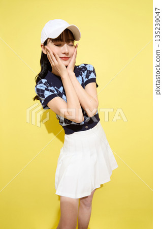 Portrait of a young woman wearing cute sportswear against a light background 135239047
