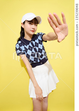 Portrait of a young woman wearing cute sportswear against a light background 135239048