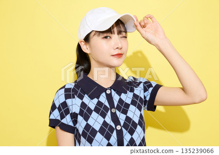 Portrait of a young woman wearing cute sportswear against a light background 135239066