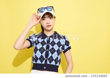 Portrait of a young woman wearing cute sportswear against a light background 135239085