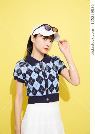 Portrait of a young woman wearing cute sportswear against a light background 135239086