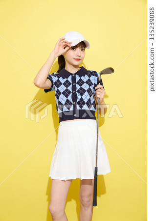 Portrait of a young woman wearing cute sportswear against a light background 135239088