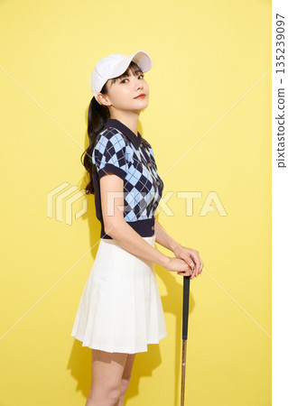 Portrait of a young woman wearing cute sportswear against a light background 135239097