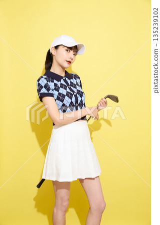 Portrait of a young woman wearing cute sportswear against a light background 135239102