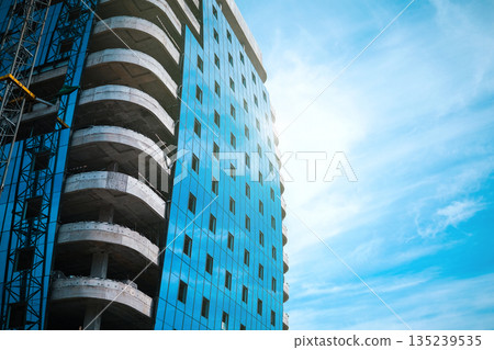 Tall modern building being built from concrete. High quality photo Tall modern building being built from concrete. High quality photo 135239535