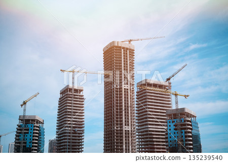 Tall modern building being built from concrete. High quality photo Tall modern building being built from concrete. High quality photo 135239540