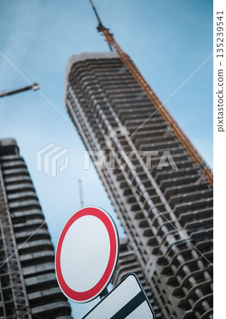 Tall modern building being built from concrete. High quality photo Tall modern building being built from concrete. High quality photo 135239541