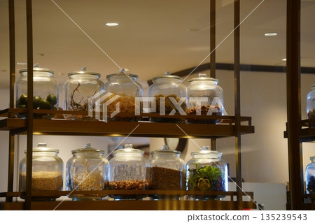 Spice jars in a restaurant kitchen. Background with copy space Spice jars in a restaurant kitchen. Background with copy space 135239543