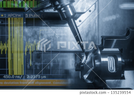 Abstract 5-axis CNC milling machine cutting the automotive part and graph display background in the light blue scene. 135239554