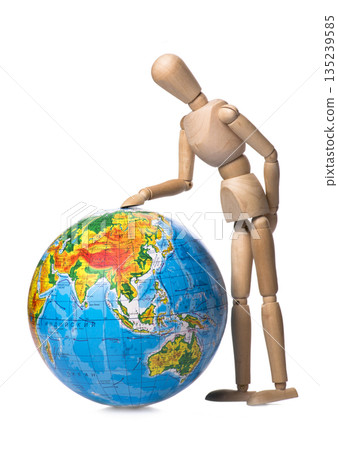 Figurine human hand touches the globe Figurine human hand touches the globe 135239585