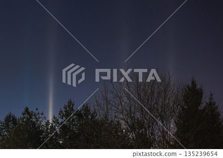 Light Pillars. Rare meteorological phenomena. Winter nature landscape Light Pillars. Rare meteorological phenomena. Winter nature landscape 135239654