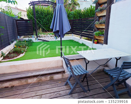 Garden with white chair 135239916