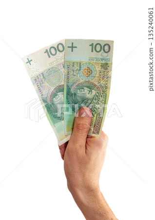 Old and new one version of 100 PLN banknote in hand. Old and new one version of 100 PLN banknote in hand. 135240061