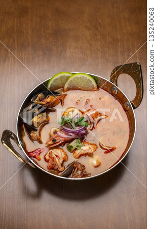 mixed seafood tom yum thai curry soup indoors ina a phuket thailand restaurant mixed seafood tom yum thai curry soup indoors ina a phuket thailand restaurant 135240068