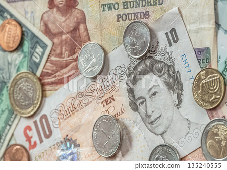 Close up Cash money World Currencies Banknotes, coins from different countries Close up Cash money World Currencies Banknotes, coins from different countries 135240555