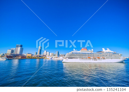 Yokohama cityscape in Japan, Mount Fuji and Asuka III (towards Osanbashi Pier), Nippon Maru at Shinko Pier, and two Japanese luxury cruise ships Yokohama cityscape in Japan, Mount Fuji and Asuka III (towards Osanbashi Pier), Nippon Maru at Shinko Pier, and two Japanese luxury cruise ships 135241104