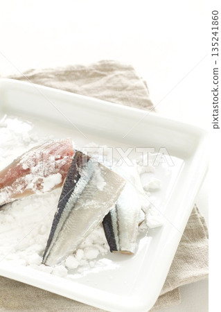 Pacific saury fillets coated with potato starch Pacific saury fillets coated with potato starch 135241860