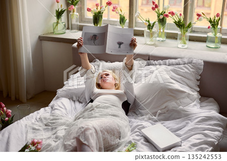 Serene morning amidst blooming tulips, Tranquil home setting filled with tulips and soft natural lighting 135242553