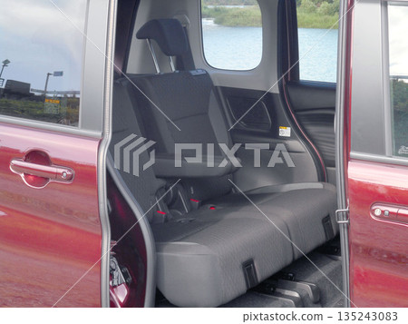 Back seat of a compact car with sliding doors 135243083