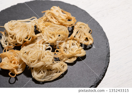 Image of a snack made from rolled and deep-fried somen noodles Image of a snack made from rolled and deep-fried somen noodles 135243315