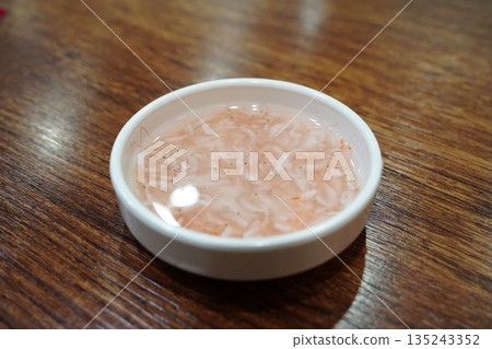 Delicious Korean salted fermented shrimp (Saeujeot) in a white bowl, a traditional condiment Delicious Korean salted fermented shrimp (Saeujeot) in a white bowl, a traditional condiment 135243352