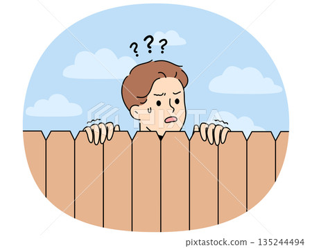 Curious neighbor looks over fence to find out what is happening on street or to spy 135244494