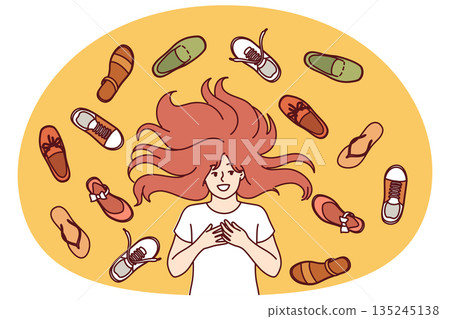 Happy teenage girl lies among shoes scattered on floor, choosing what to wear for walk in park 135245138