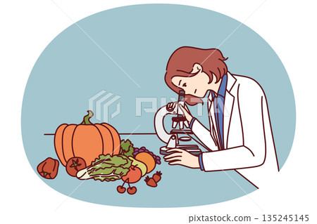 Checking quality of food in laboratory by woman using microscope to look for nitrates and pesticides 135245145