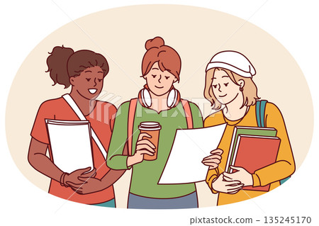 Multiethnic college girls holding books and papers agreeing to study together for exams 135245170