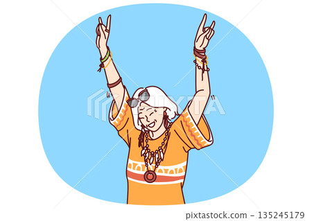 Mature hippie woman in fashionable clothes and accessories enjoys life dancing at parties 135245179