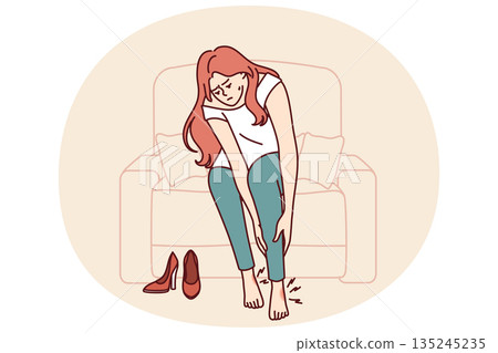 Woman suffers from pain in legs or varicose veins due to use of uncomfortable shoes with high heels 135245235