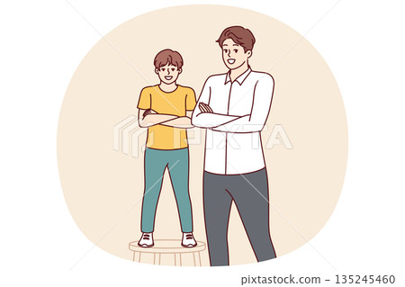 Father and son smiling standing with arms crossed and looking at screen for concept of parenthood Father and son smiling standing with arms crossed and looking at screen for concept of parenthood 135245460