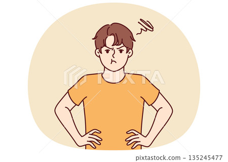 Angry boy looks at screen and keeps hands on belt trying to protest against wishes of parents 135245477