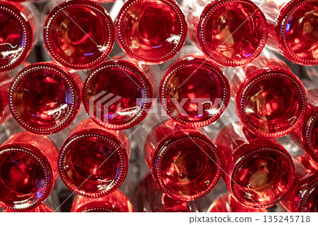 Close Up Of Red Bottle Tops From Above Creating A Festive, Glossy Pattern Close Up Of Red Bottle Tops From Above Creating A Festive, Glossy Pattern 135245718