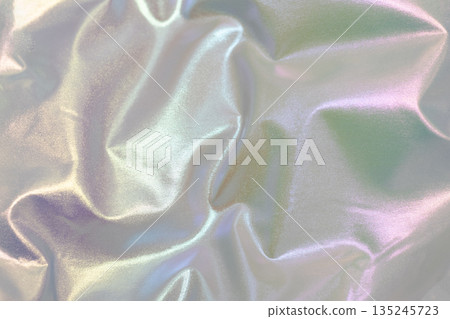 Iridescent satin fabric folds create soft glow and reflective light for luxury fashion and design Demonstrating Pantone color of the year 2026 - Cloud Dancer. 135245723