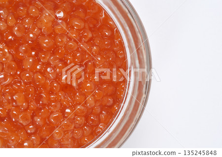 Red trout caviar in a glass jar 135245848