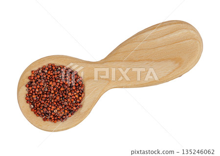 red quinoa seeds in wooden spoon isolated on white background. Top view. Flat lay red quinoa seeds in wooden spoon isolated on white background. Top view. Flat lay 135246062
