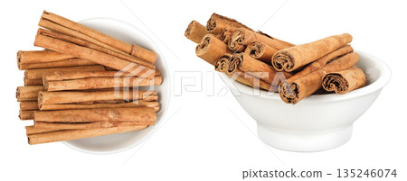 Cinnamon sticks in ceramic bowl isolated on white background with full depth of field. Top view. Flat lay. Cinnamon sticks in ceramic bowl isolated on white background with full depth of field. Top view. Flat lay. 135246074