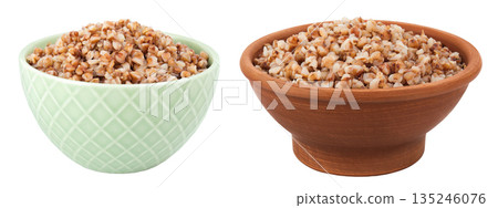 Boiled buckwheat in a ceramic bowl isolated on white background 135246076
