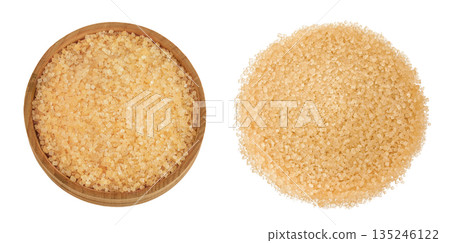 The brown sugar in wooden bowl isolated on white background. Top view. Flat lay The brown sugar in wooden bowl isolated on white background. Top view. Flat lay 135246122
