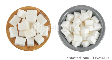 Sugar cubes in a wooden and ceramic bowl isolated on white background. Top view. Flat lay Sugar cubes in a wooden and ceramic bowl isolated on white background. Top view. Flat lay 135246123