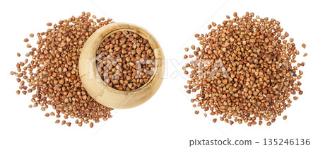 Raw buckwheat in wooden bowl isolated on white background. Top view. Flat lay Raw buckwheat in wooden bowl isolated on white background. Top view. Flat lay 135246136