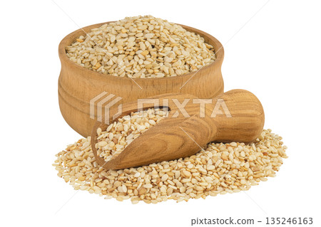Sesame seeds in wooden bowl and scoop isolated on white background 135246163