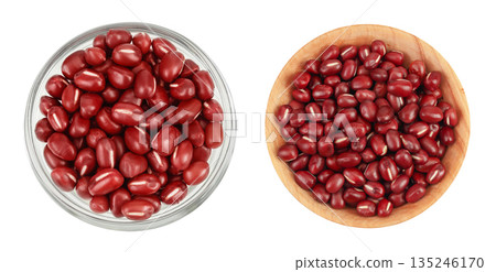 Red adzuki beans in glass and wooden bowl isolated on white background. Top view. Flat lay. 135246170