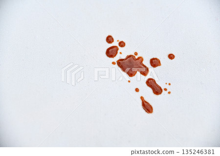 dirty tomatoes sauce stain on white fabric with stains for cleaning concept idea dirty tomatoes sauce stain on white fabric with stains for cleaning concept idea 135246381