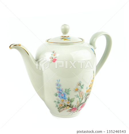 Vintage porcelain teapot with floral pattern on white background. Vintage porcelain teapot with floral pattern on white background. 135246543